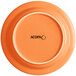 An orange Acopa stoneware plate with black text reading "Valencia" on it.