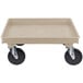 A tan rectangular plastic dolly base with black wheels.