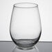 A Libbey stemless white wine glass on a table.
