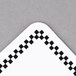 A white square deli tag with a black checkered border.