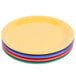 A stack of GET Diamond Mardi Gras melamine plates in assorted colors.