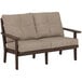 A POLYWOOD mahogany outdoor loveseat with a tan cushion.