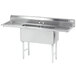 A stainless steel Advance Tabco two compartment pot sink with two drainboards.