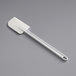 A white plastic spatula with a handle.