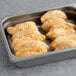 A pan filled with Mrs. Friday's Tavern Battered Cod Fillet portions.