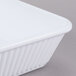 A white rectangular GET melamine casserole dish with a lid.