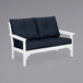 A white POLYWOOD loveseat with navy cushions.