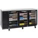 A Turbo Air Super Deluxe narrow back bar cooler with 2 glass doors filled with bottles of beer.