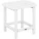 A POLYWOOD white side table with a wooden top on an outdoor patio.