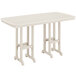 A sand colored POLYWOOD rectangular bar height table with two legs.