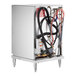 A stainless steel Noble Warewashing undercounter dishwasher with hoses and pipes.