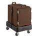 A brown CaterGator food pan carrier on a black cart.