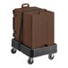 A brown container on a black cart.