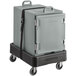 A slate blue CaterGator food pan carrier on a black dolly.