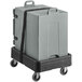 A grey CaterGator food pan carrier on a black dolly.