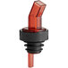 A red plastic liquor pourer with a black collar.