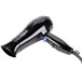 A black Conair compact hair dryer with a cord