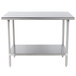 A stainless steel Advance Tabco work table with undershelf.