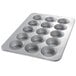 A Chicago Metallic muffin pan with fifteen cupcake holes.