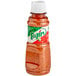 A bottle of Tajin Classic Seasoning with a red label and white lid.