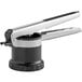 A stainless steel OXO Good Grips 3-in-1 potato ricer being used.