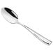 a silver spoon on a white background