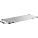 A stainless steel rectangular heated shelf with a power cord.