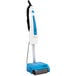 A white and blue Namco Floorwash 1000 walk behind cylindrical floor scrubber.