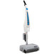 A Namco Floorwash 5000 walk behind floor scrubber with a white base and blue handle.