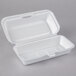 A white foam container with a hinged lid.