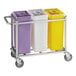 A Baker's Lane mobile triple ingredient bin with yellow, white, and purple plastic containers with clear lids on a cart.