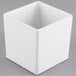 A white square Cal-Mil melamine jar with a square top.