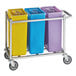 A yellow, blue, and purple Baker's Lane ingredient bin on a metal cart.