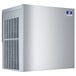 A white rectangular stainless steel Manitowoc air cooled ice machine with a blue sticker on it.