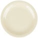 A tan Carlisle Kingline bread and butter plate with a yellow rim on a white surface.