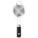 An OXO stainless steel strainer with a handle.