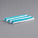 A blue and white striped Monarch Brands pool towel.