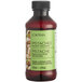 A close up of a bottle of LorAnn Oils Pistachio Bakery Emulsion with a white label.