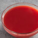 a glass bowl of red liquid