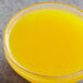 a bowl of yellow liquid
