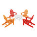 A white table with a black edge surrounded by a red, orange, and white POLYWOOD Adirondack chairs.