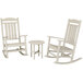 A white POLYWOOD rocking chair and table set.