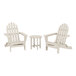 A white POLYWOOD patio set with 2 Adirondack chairs and a table.