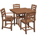 A POLYWOOD wooden dining table and four brown chairs on an outdoor patio.