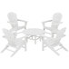 A group of POLYWOOD white Adirondack chairs around a round table.