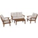 A white POLYWOOD deep seating chair with a cushion next to a brown wood table.