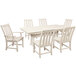 A white POLYWOOD dining table with a white background and six white chairs.