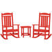 A red POLYWOOD wooden rocking chair and table set.