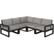 A black and grey POLYWOOD sectional couch with cushions.