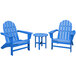 A group of blue POLYWOOD Vineyard Adirondack chairs and a round table.